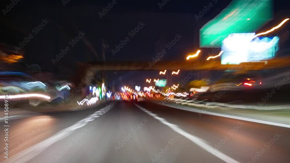 Driving at night in Bangkok downtown (drive time lapse). Night driving with car with cars in motion.
Driving at night in Bangkok downtown (drive time lapse). Night driving with car with cars in motion.