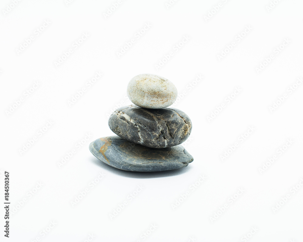 Three stones are stacked isolated on white background. Zen stone. Three stones are stacked isolated on white background. Zen stone.