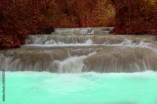 waterfall in rainforest. cascade in forest. water flowing in tropical jungle