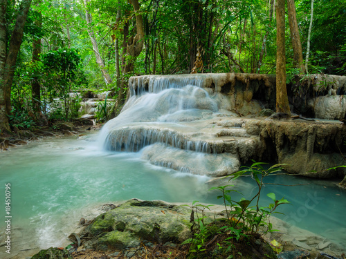 Deep forest waterfall in Thailand (Erawan Waterfall). © bomboman