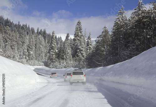 Driving in snow. Cars on the snowy road.
