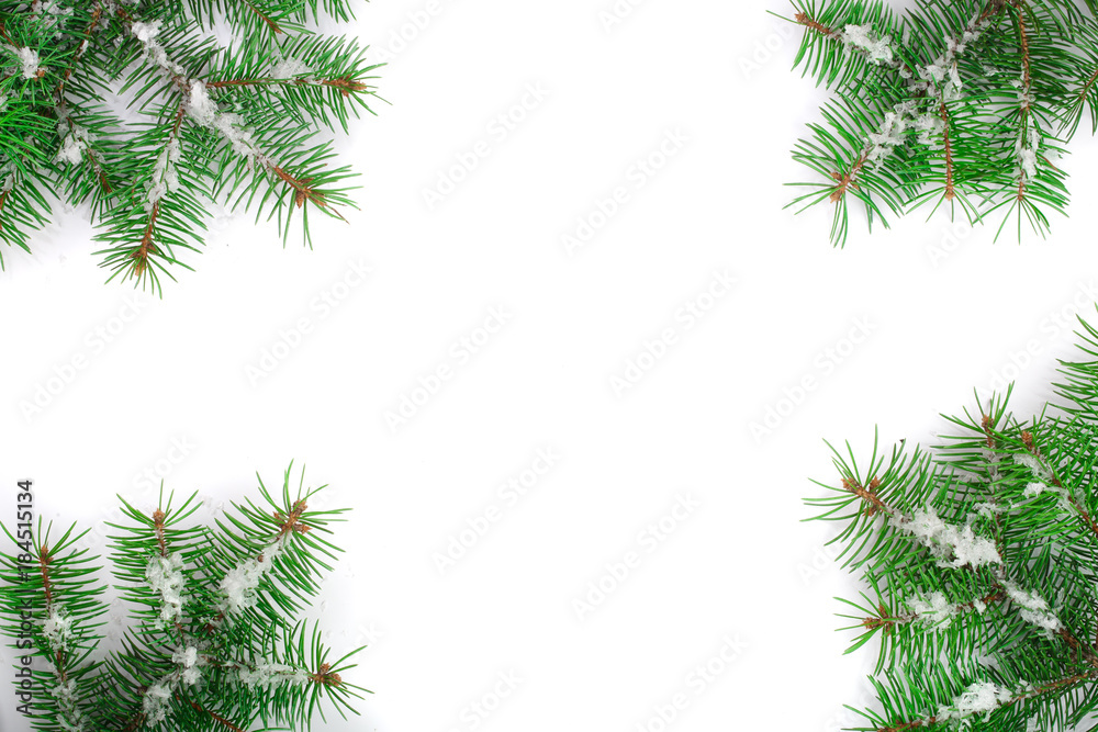 Christmas Frame of Fir tree branch with snow isolated on white background with copy space for your text. Top view