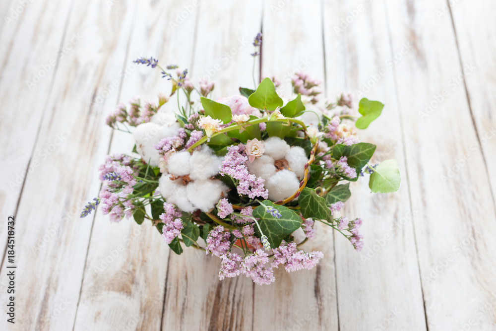 Bouquet of flowers on a old wooden background