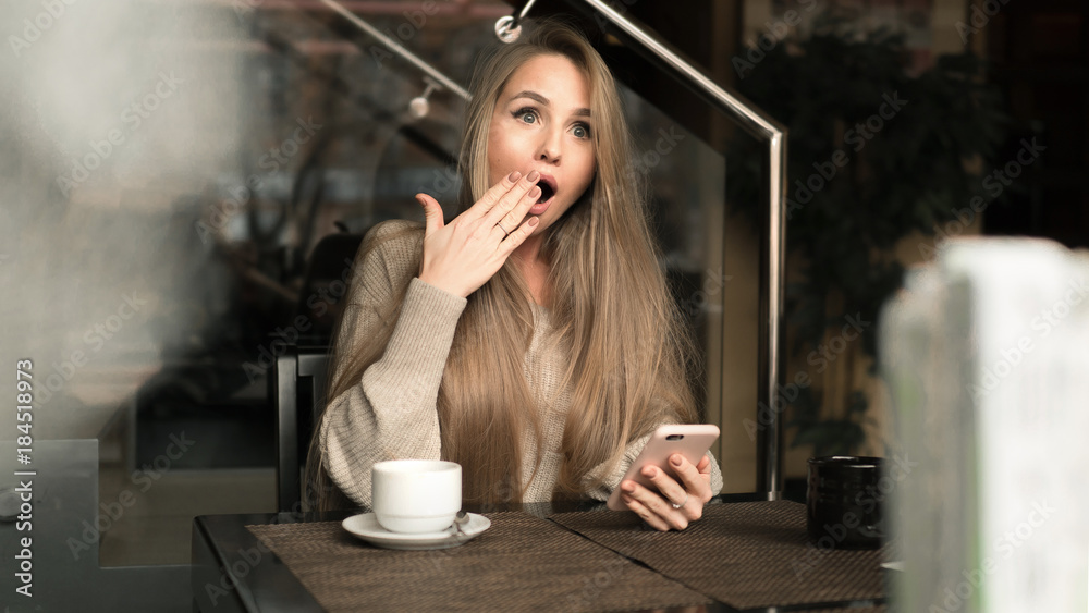 SMS. Closeup portrait funny shocked anxious scared young girl looking at  phone seeing bad news photos message with disgusting emotion on face  through coffee shop background. Human reaction, expression Stock Photo |