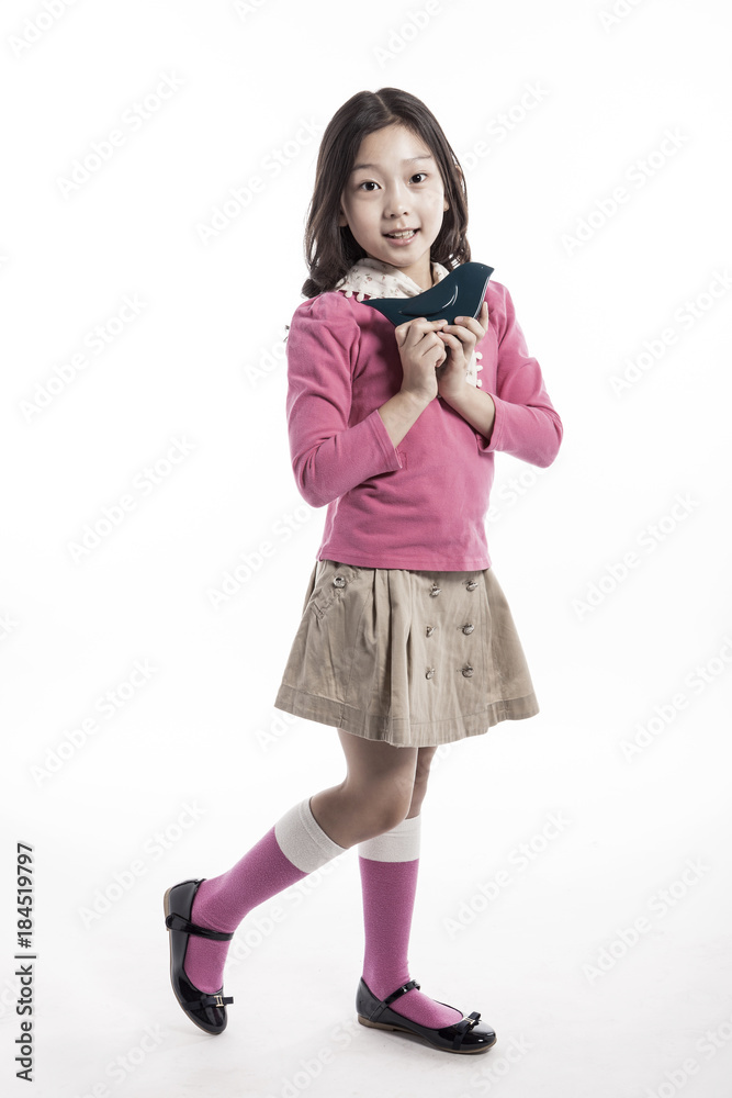 girl(kid) hand hold a ceramic bird isolated on the white background. girl(kid) hand hold a ceramic bird isolated on the white background.