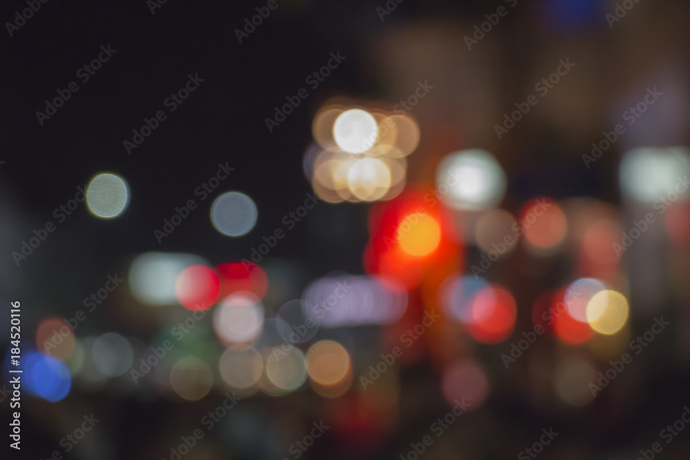 Night bokeh from light on the Road. Street light bokeh. Lights blurred bokeh background from christmas night party for your design.