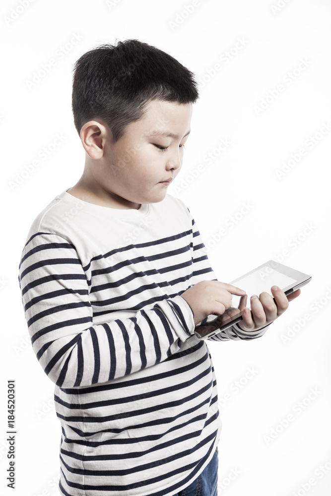 boy(kid) hand hold a tablet pc isolated on the white background. boy(kid) hand hold a tablet pc isolated on the white background.