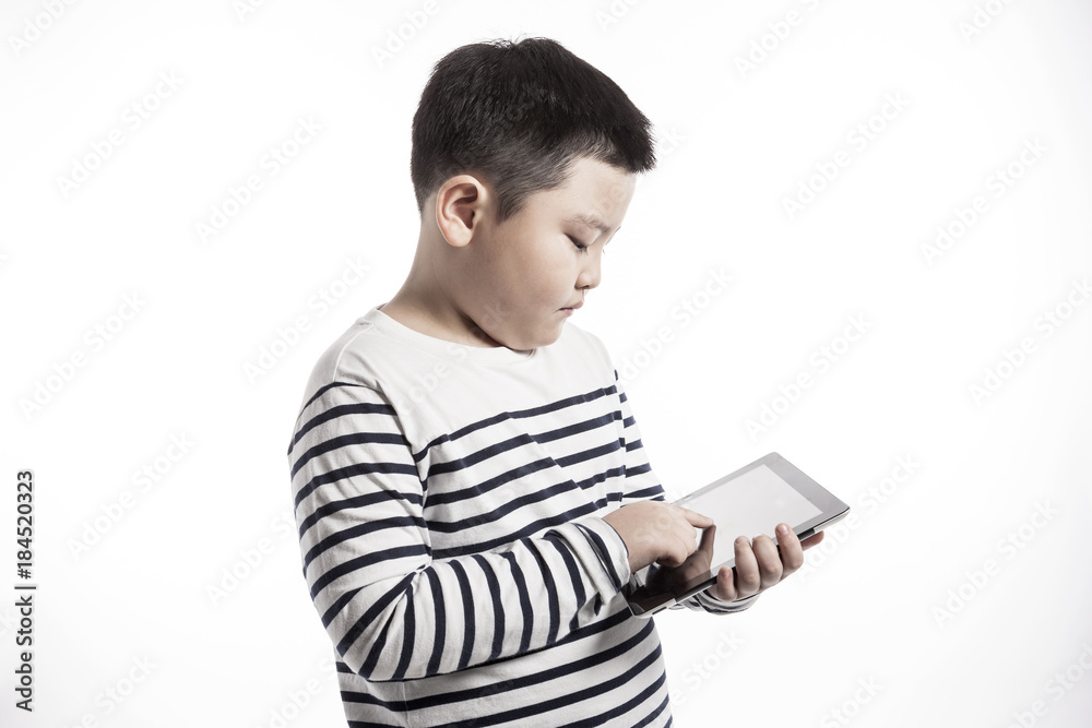 boy(kid) hand hold a tablet pc isolated on the white background. boy(kid) hand hold a tablet pc isolated on the white background.