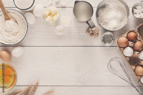 Baking ingredients on rustic white background