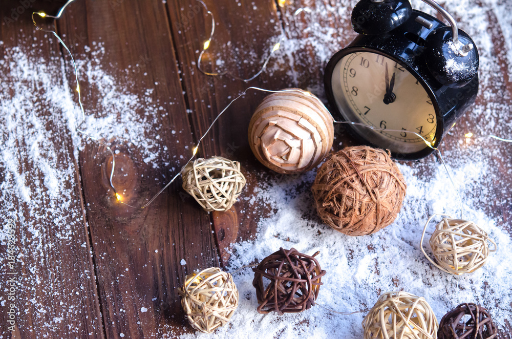 Crystals of ice on a natural wooden background. Christmas mood. Vintage watches and Christmas decorations in snow and on a natural wooden background. Crystals of ice on a natural wooden background. Christmas mood. Vintage watches and Christmas decorations in snow and on a natural wooden background.