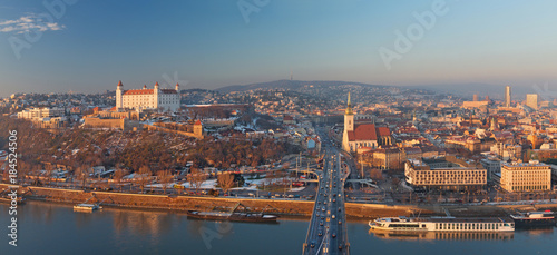 Bratislava - Panoramic skyline of the City from SNP Bridge in sunset lilght. photo