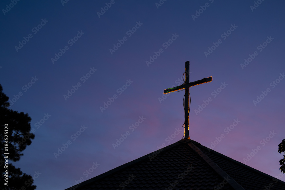 silhouette cross on church roof with sky at dawn. silhouette cross on church roof with sky at dawn.