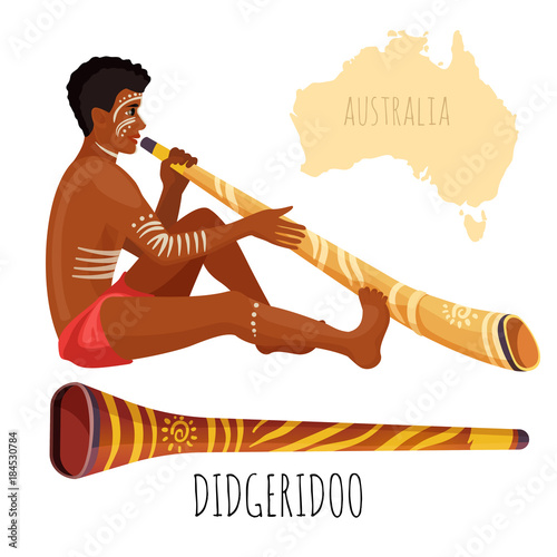 Swarthy man with white paint on face plays didgeridoo photo