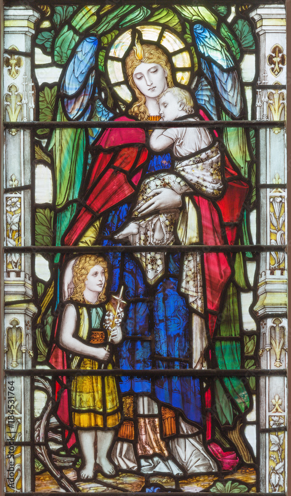 LONDON, GREAT BRITAIN - SEPTEMBER 17, 2017: The angel with the child Jesus and little St. John the Baptist on the stained glass in church Holy Trinity Brompton.
