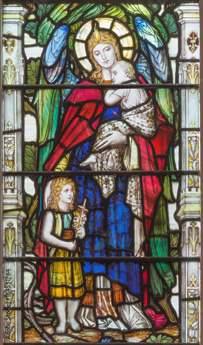 LONDON, GREAT BRITAIN - SEPTEMBER 17, 2017: The angel with the child Jesus and little St. John the Baptist on the stained glass in church Holy Trinity Brompton.