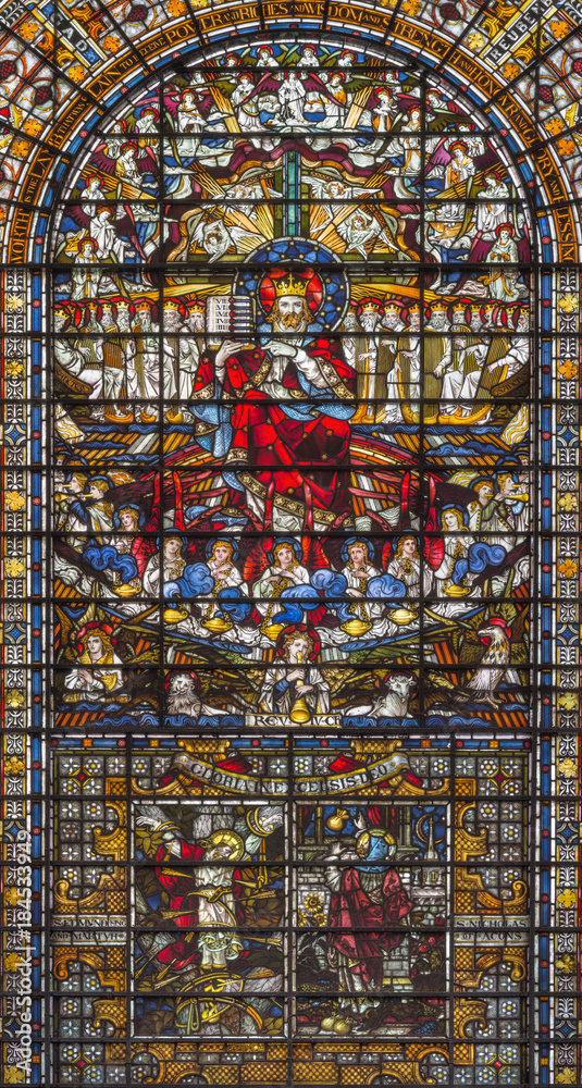 LONDON, GREAT BRITAIN - SEPTEMBER 14, 2017: The Jesus Christ the King on the stained glass in the church St. Edmund the King from 19. cent.