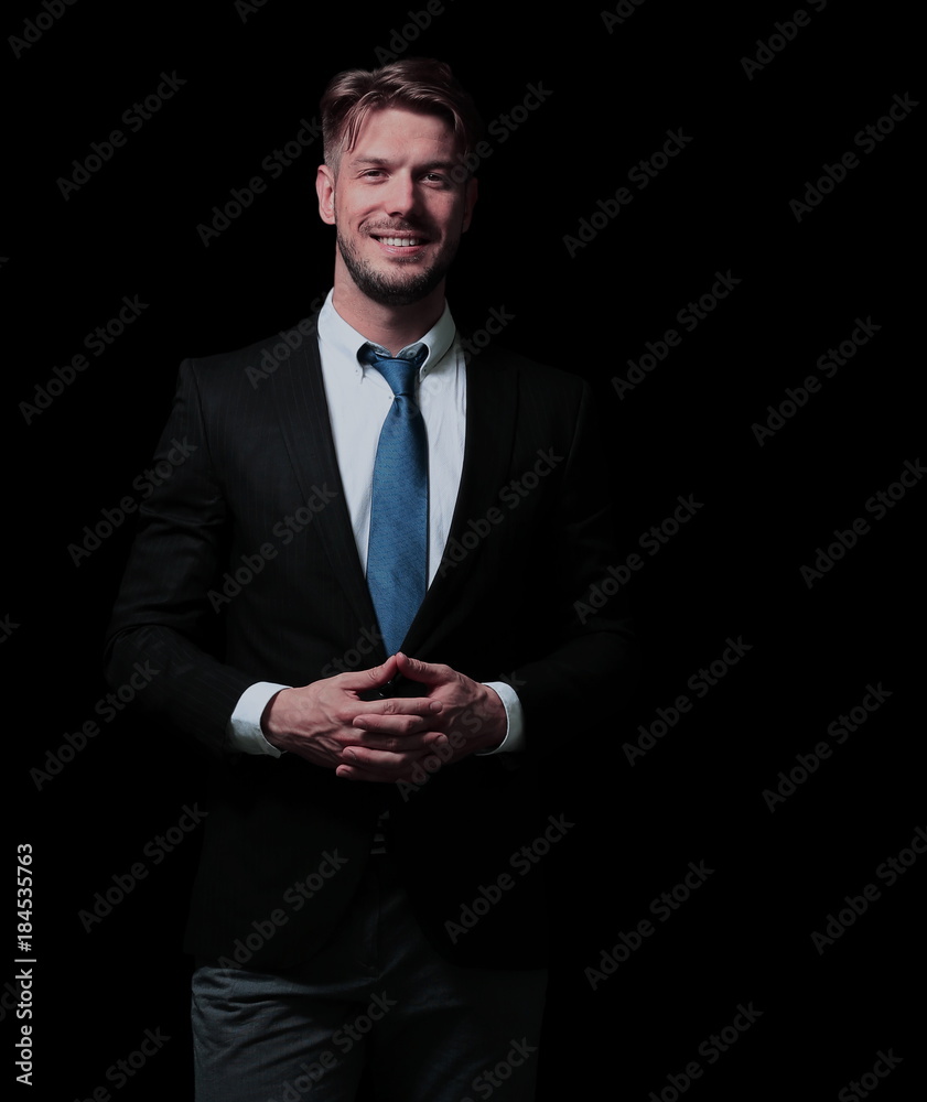Handsome elegant business man isolated on black Handsome elegant business man isolated on black