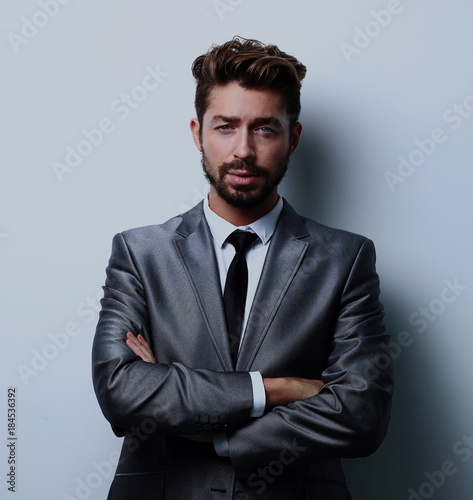 Close up portrait of a smiling handsome business man over white