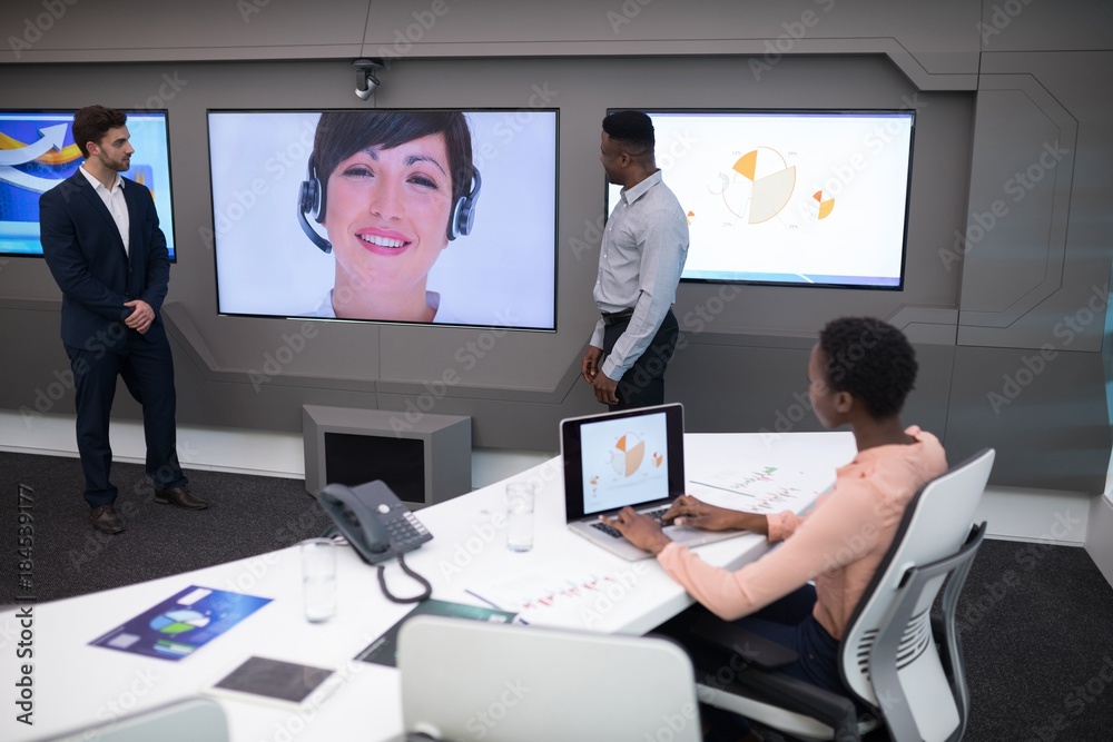 Male and female executives having video call Male and female executives having video call
