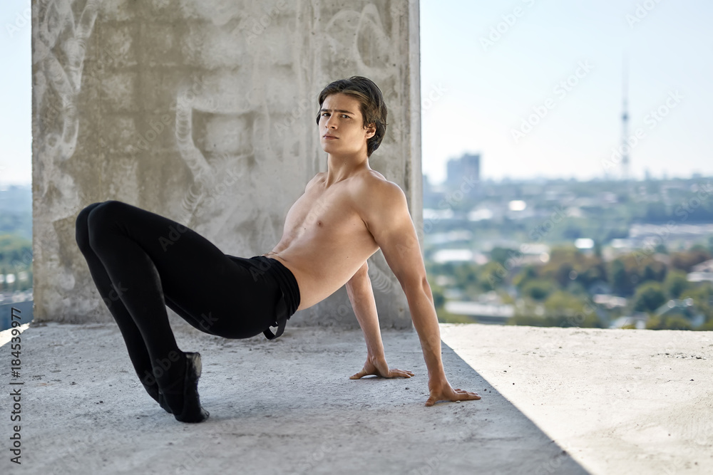 Ballet dancer posing at unfinished building Ballet dancer posing at unfinished building