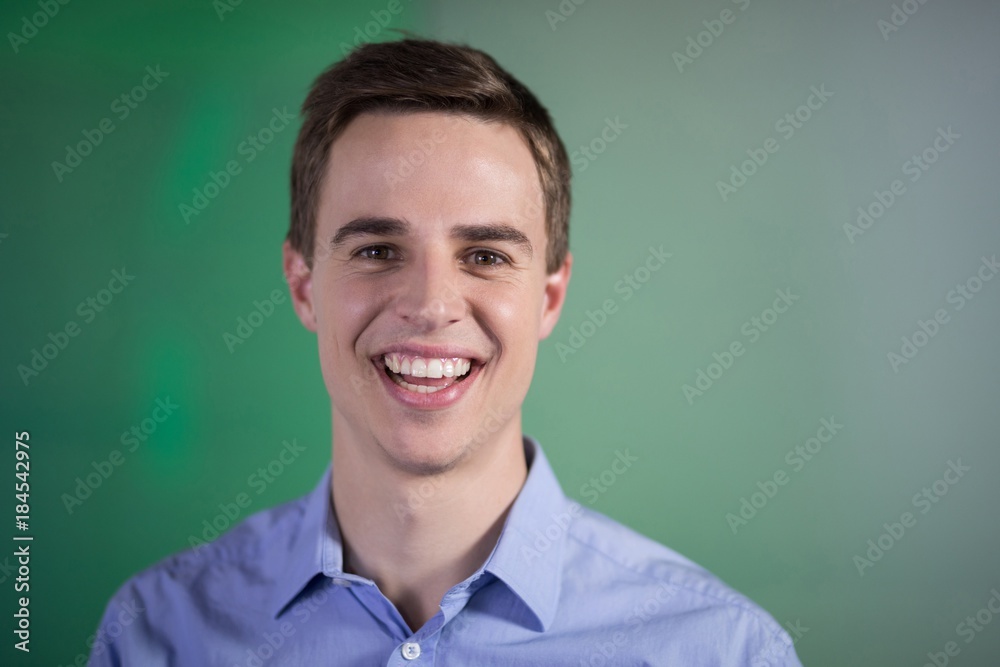 Happy male executive in office