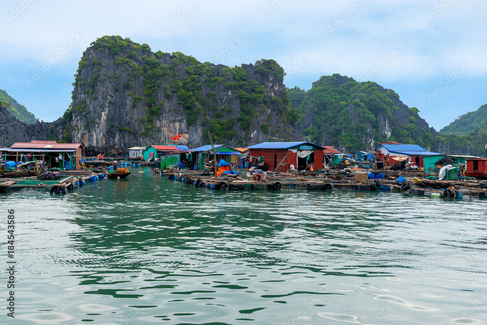 Floating fishing village and rock island in Lan Ha Bay destination beautiful sea and the beach in Vietnam, Southeast Asia. UNESCO World Heritage Site.