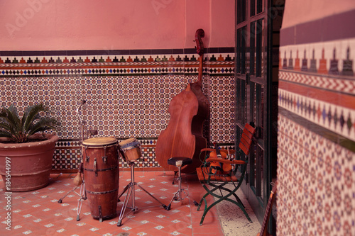 Musical Instruments in the background of a decorative wall, streets of Havana, Cuba © Made