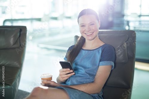 Portrait of female executive using mobile phone Free Download Portrait of female executive using mobile phone - GFXLoad