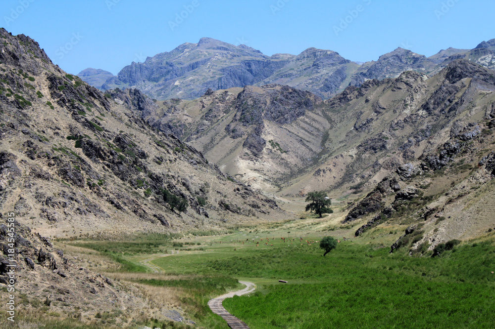 Mountain valley and stony slopes and mountain peaks at the foot of the Tien Shan. China.