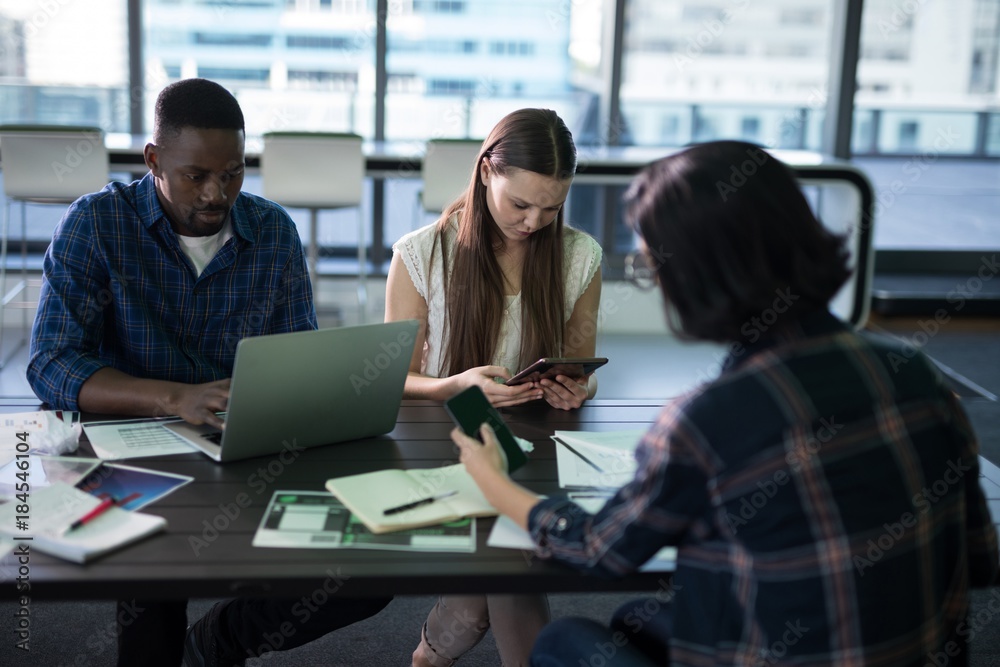 Executives working together in office Executives working together in office