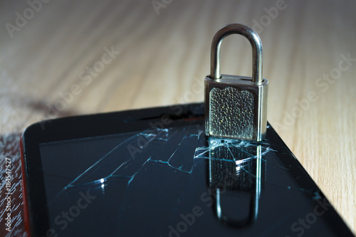 the lock with reflection and the broken smartphone