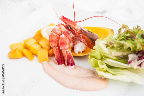 Shrimps cocktail with fresh mango salad and creamy dressing