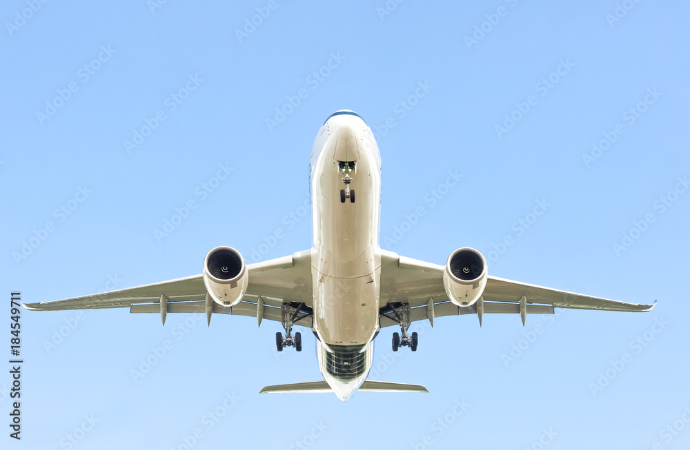 large passenger jet in a clear blue sky