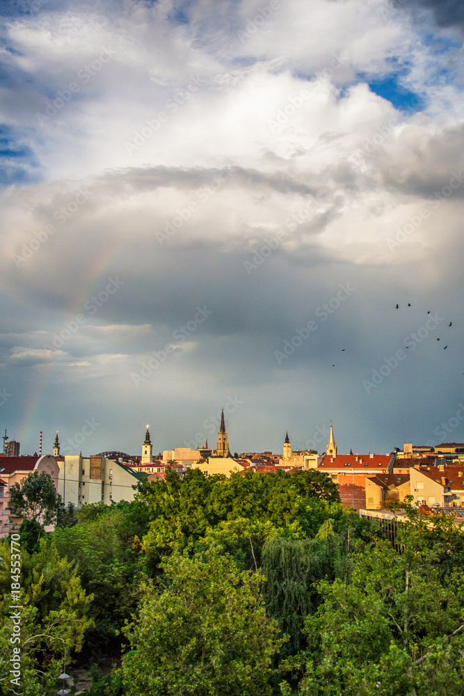 Novi Sad, Serbia August 02, 2014: Panorama of Novi Sad churches and rainbow