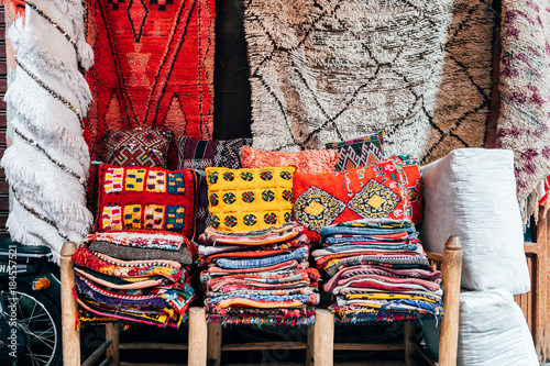 colorful carpets hanging at moroccan shops, marrakech
