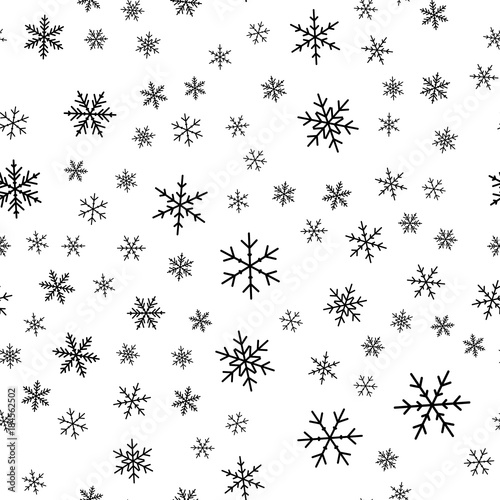 Black snowflakes seamless pattern on white Christmas background. Chaotic scattered black snowflakes. Unique Christmas creative pattern. Vector illustration.