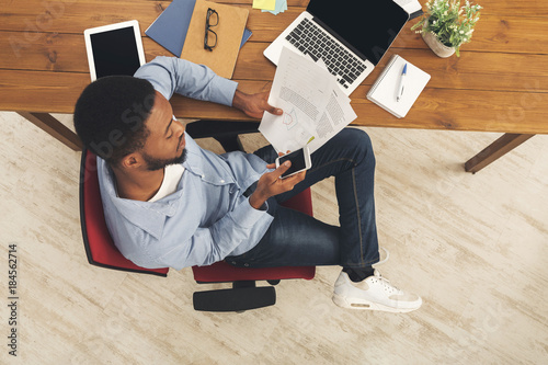 African-american businessman reading report