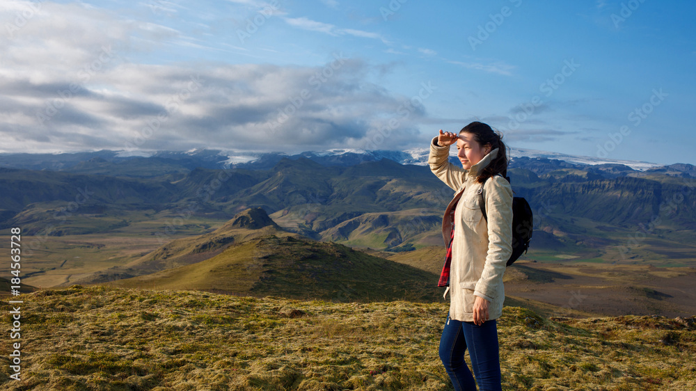 Woman traveler looks into the distance