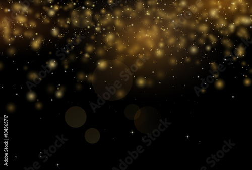 Golden sparkles in black background