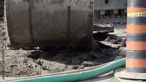 Wallpaper Mural An excavator picks up a large chunk of broken asphalt Torontodigital.ca