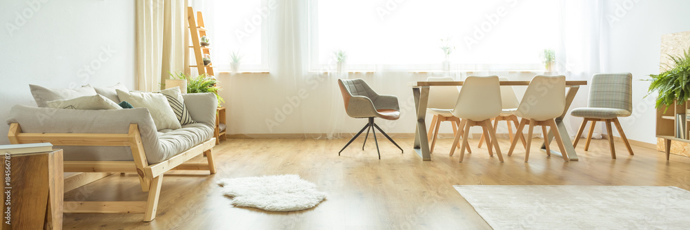 White rug in dining room