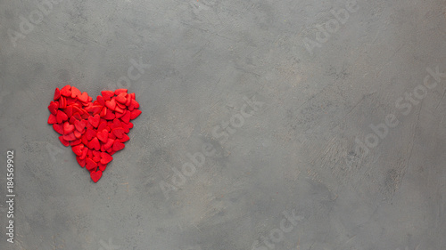 Valentines day background with  red heart. Sweet candy hearts on a gray concrete background. Romantic mood.) Beautiful background. Flat lay, top view