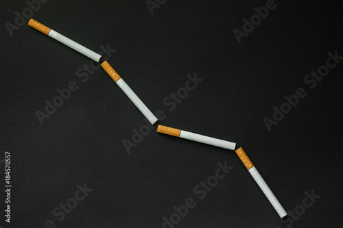 Cigarette on a dark background. quit Smoking