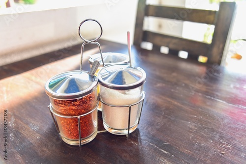 Caddy of Thai Condiments Consisting of Ground Dried Chilli Pepper and Sugar