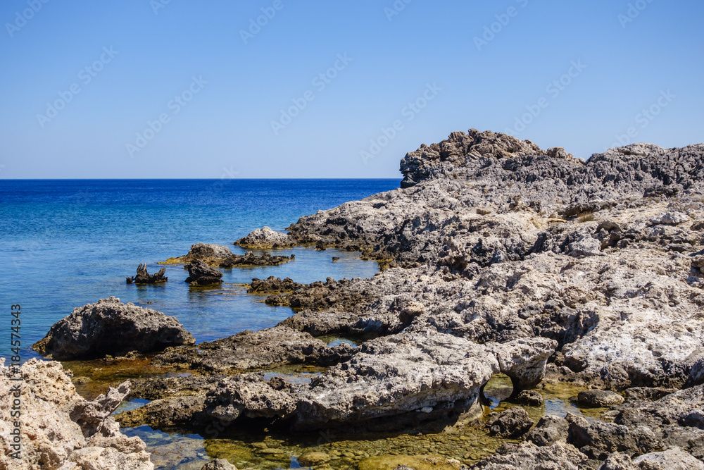 Sharp gray rocks at Faliraki beach