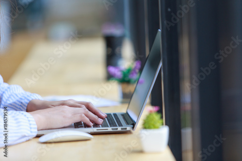 Business woman typing on laptop at workplace Woman working in home office hand keyboard, Hands of young people typing on laptop in the office,