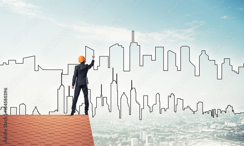 Man architect draw silhouette of modern city on blue sky. Mixed Man architect draw silhouette of modern city on blue sky. Mixed