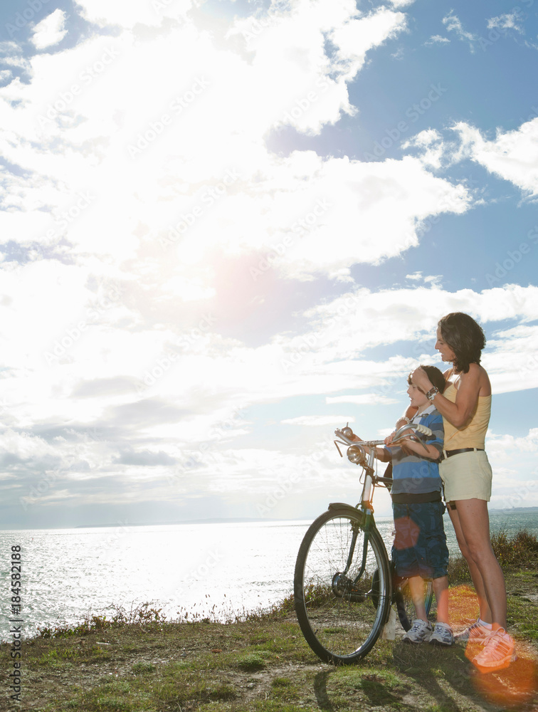 Mother and son with bicycle