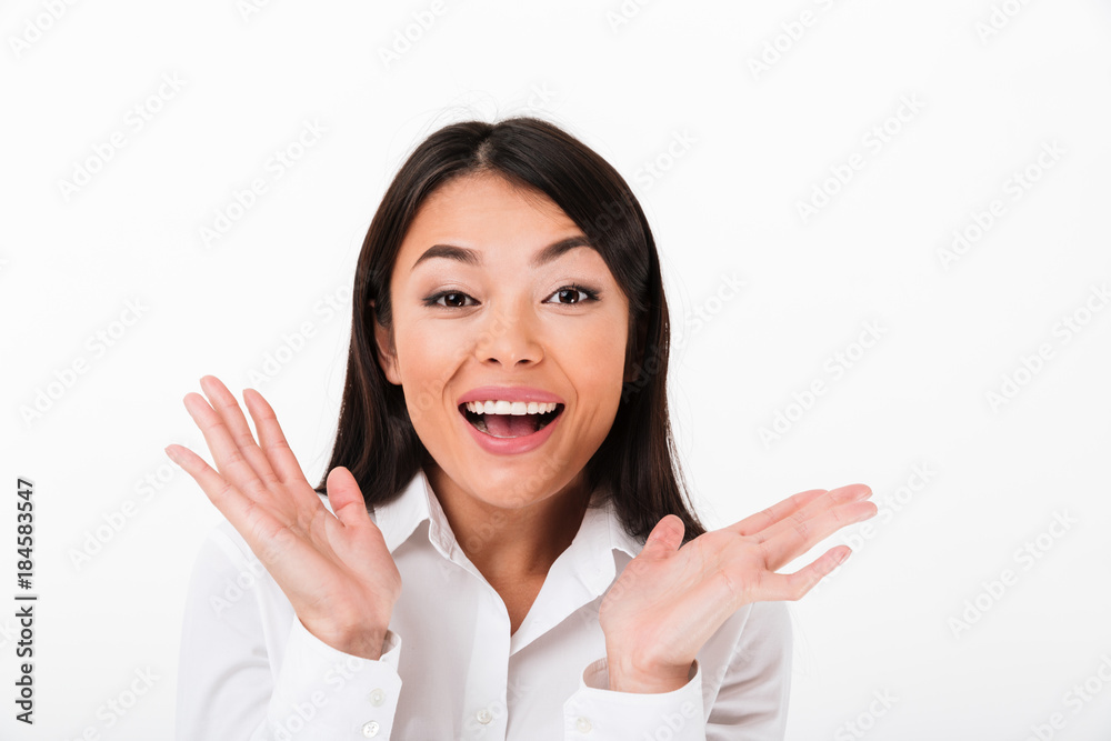 Close up portrait of a cheerful asian businesswoman celebrating Close up portrait of a cheerful asian businesswoman celebrating