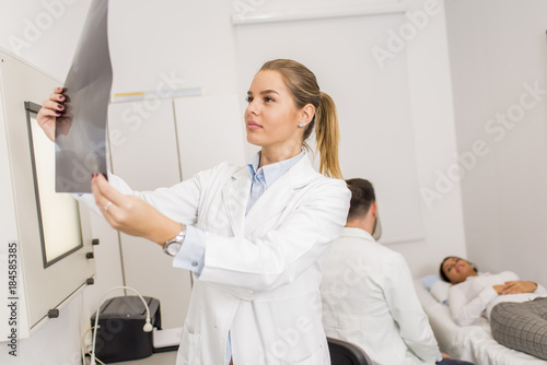 Radiologist lokking at x-ra...